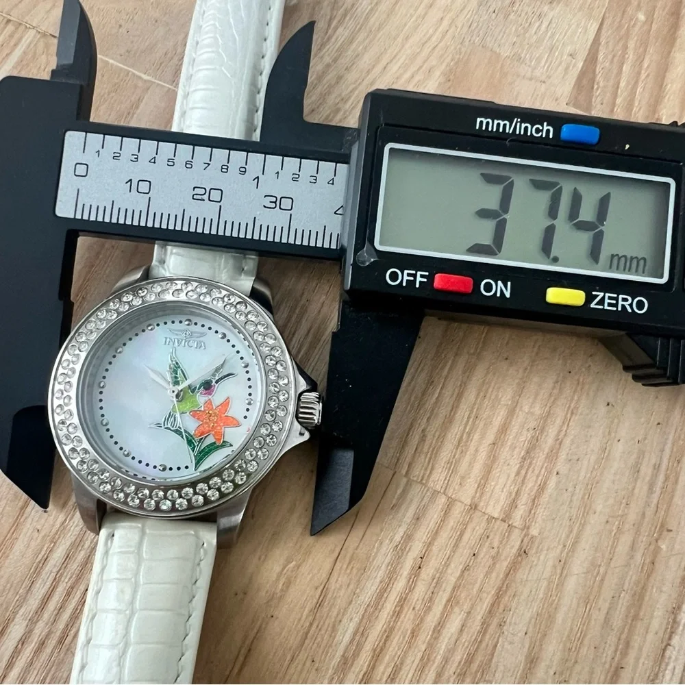 Invicta ladies hummingbird silver tone white leather watch NEW BATTERY